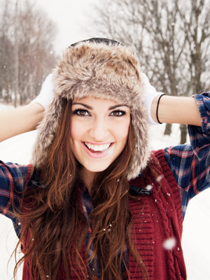 woman wearing winter hat snow