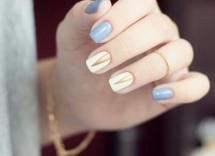 Nail art elegante lilla bianco e oro
