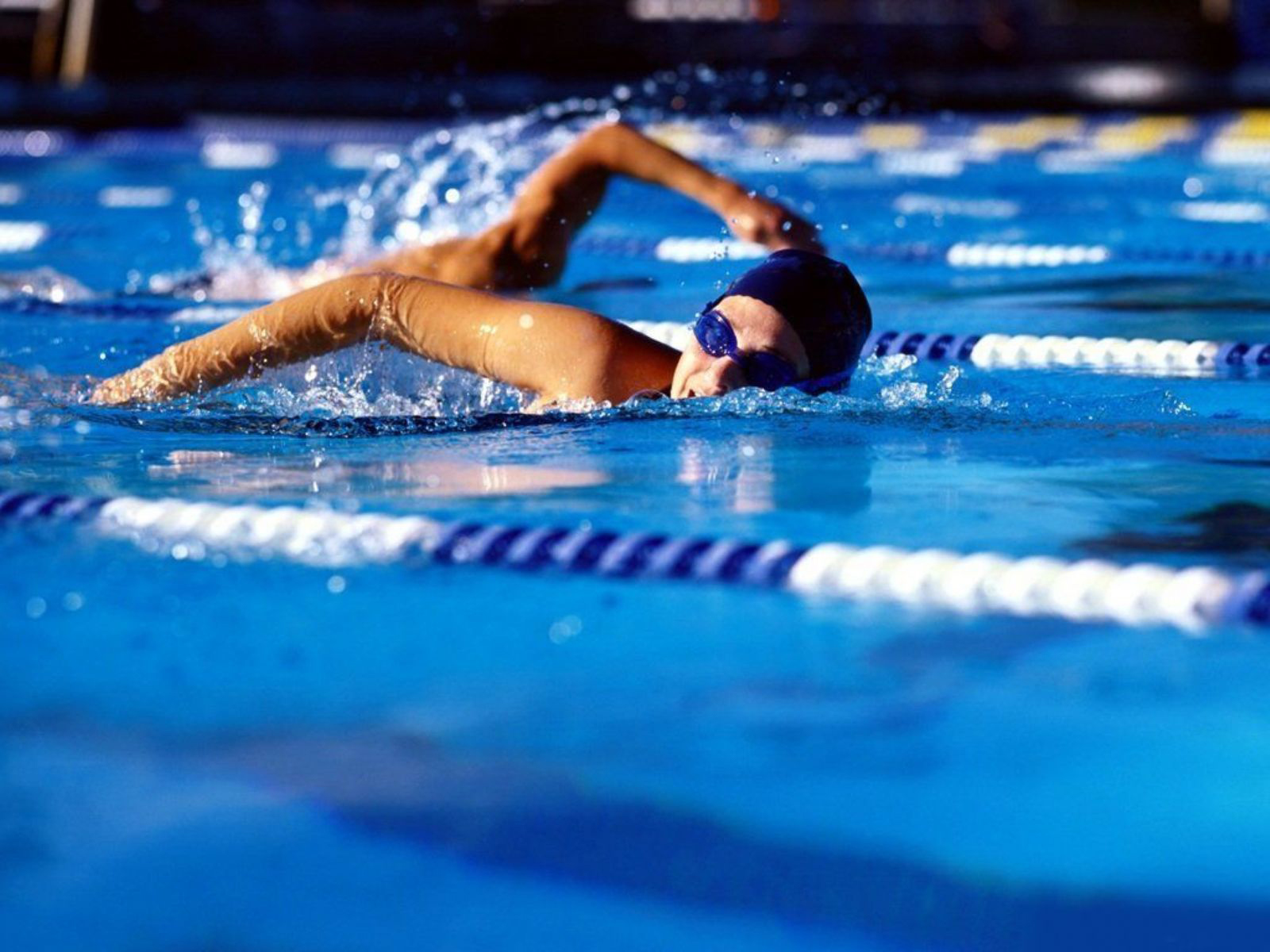 swimmer in clear blue water