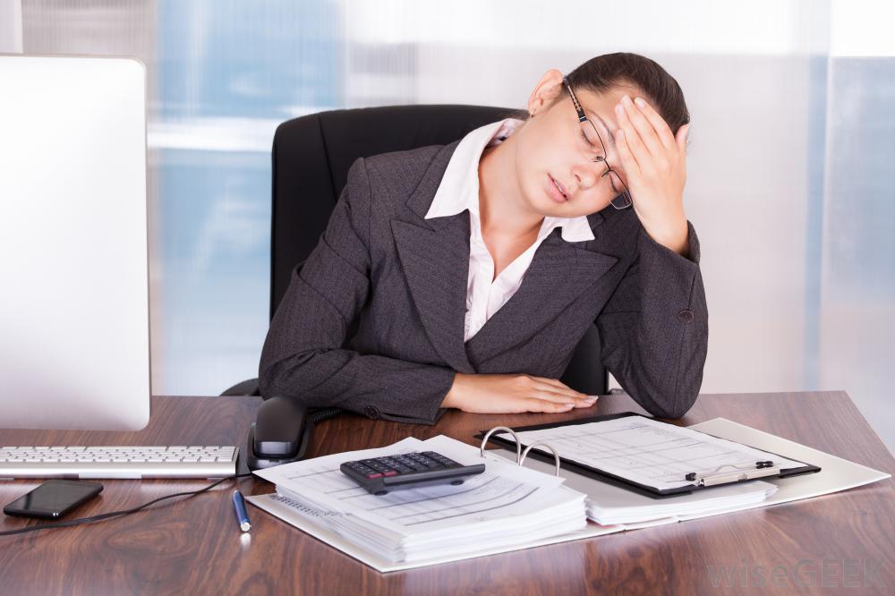 woman tired at desk